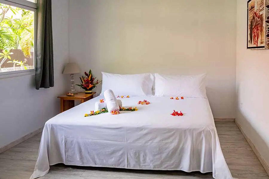 Flower-filled double bed in our Bora Bora vacation home
