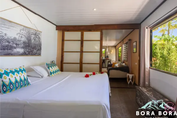 White double bed in our vacation home in Bora Bora