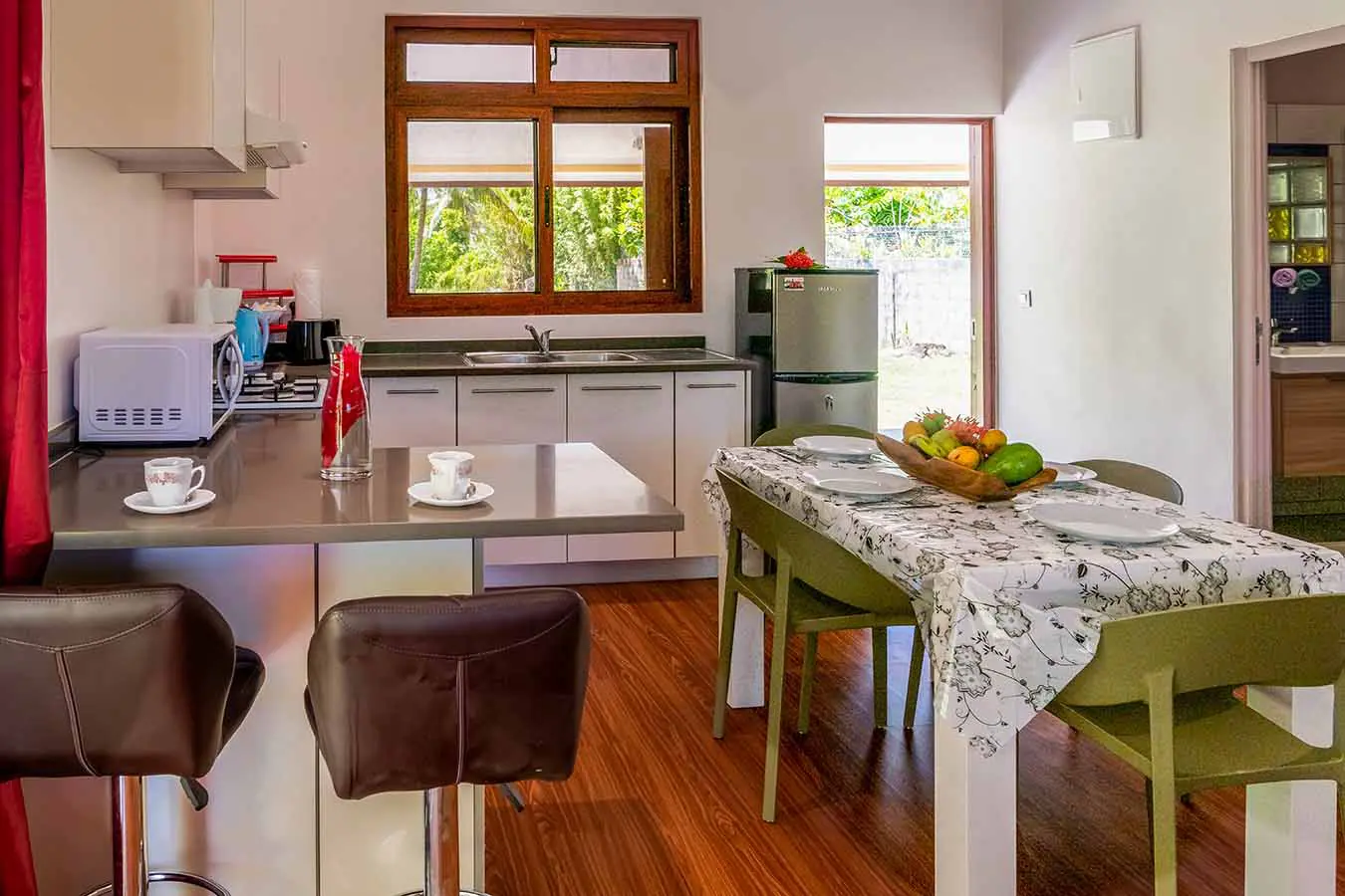 Fully-equipped kitchen with dining table in our Bora Bora vacation home