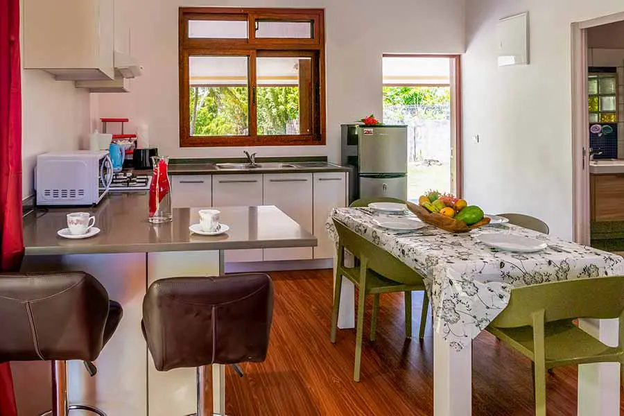 Fully-equipped kitchen with dining table in our Bora Bora vacation home