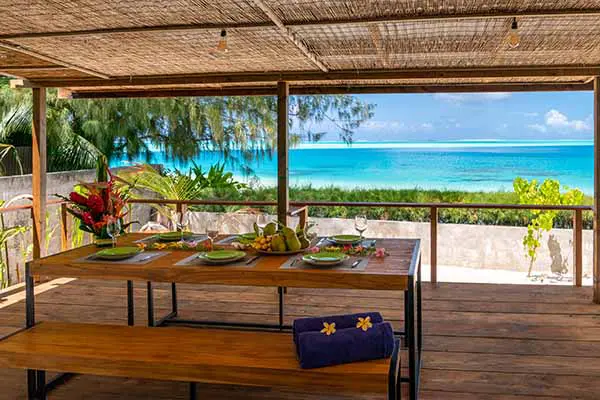 Dining table on a seaside terrace with a view of the lagoon in our Bora Bora vacation home