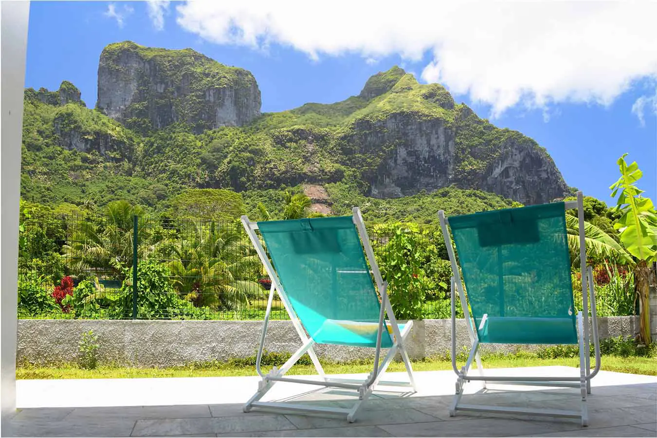 Terrace with 2 chairs and mountain view in our vacation home Vaiahi in Bora Bora